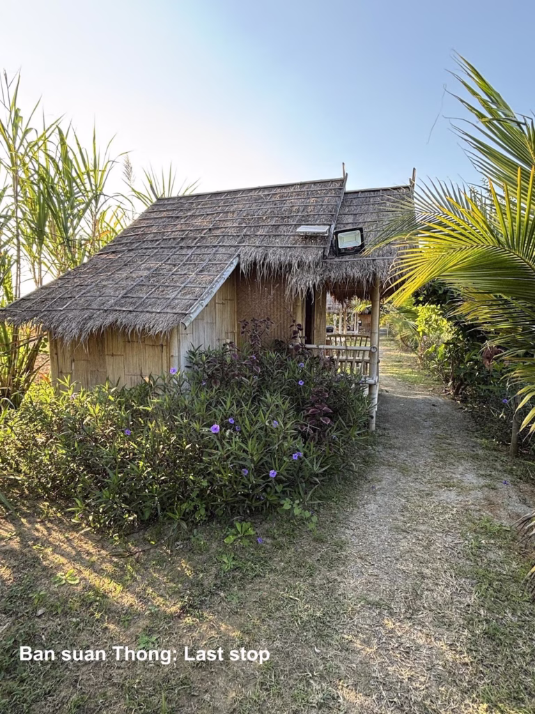Thatched hut in a garden on the Mae Hong Son Loop