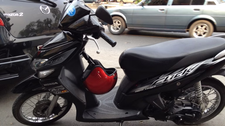 Honda Click automatic scooter parked outside a rental shop in Chiang Mai